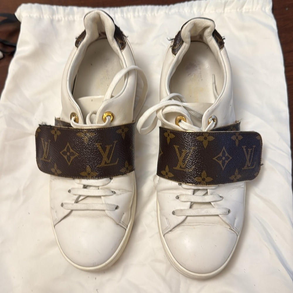 Louis Vuitton White Sneakers with Brown and Gold Accents.